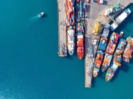 Aerial view of a busy Greek port with ships.