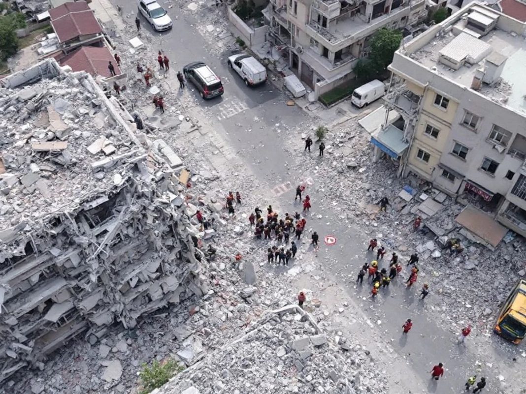 Damaged buildings and debris after earthquakes in Turkey.