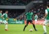 Saudi Arabia players in action during a football match.
