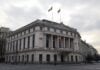 Romanian central bank building with flags in Bucharest