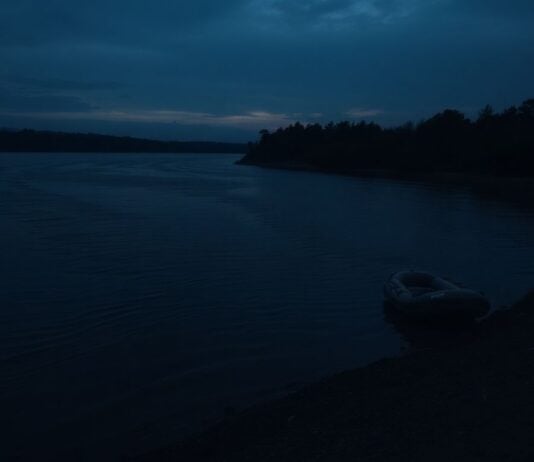 River at dusk with an empty raft.