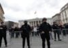 Police guard Montenegrin parliament as crowd gathers somberly