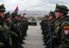 Serbian soldiers and tanks in tense city environment