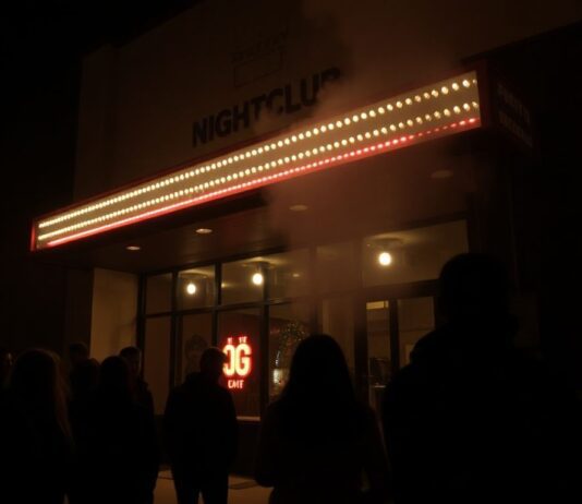 Nightclub fire aftermath with distressed crowd and emergency lights.