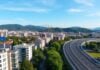 Podgorica skyline with EU flags and construction cranes
